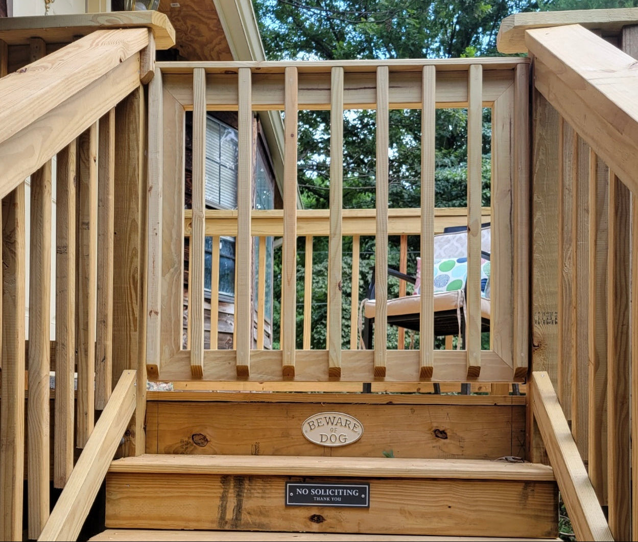 Single baluster wooden patio gate made from pressure-treated lumber