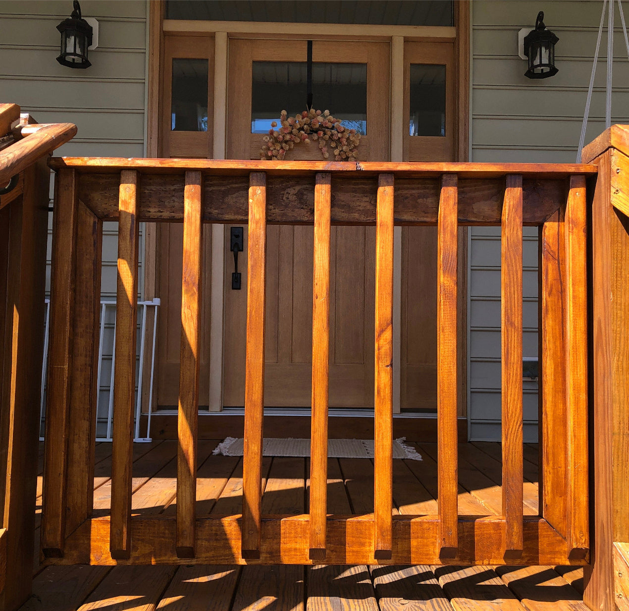 Cutom-fit wood gate with vertical wooden balusters for front yard patio