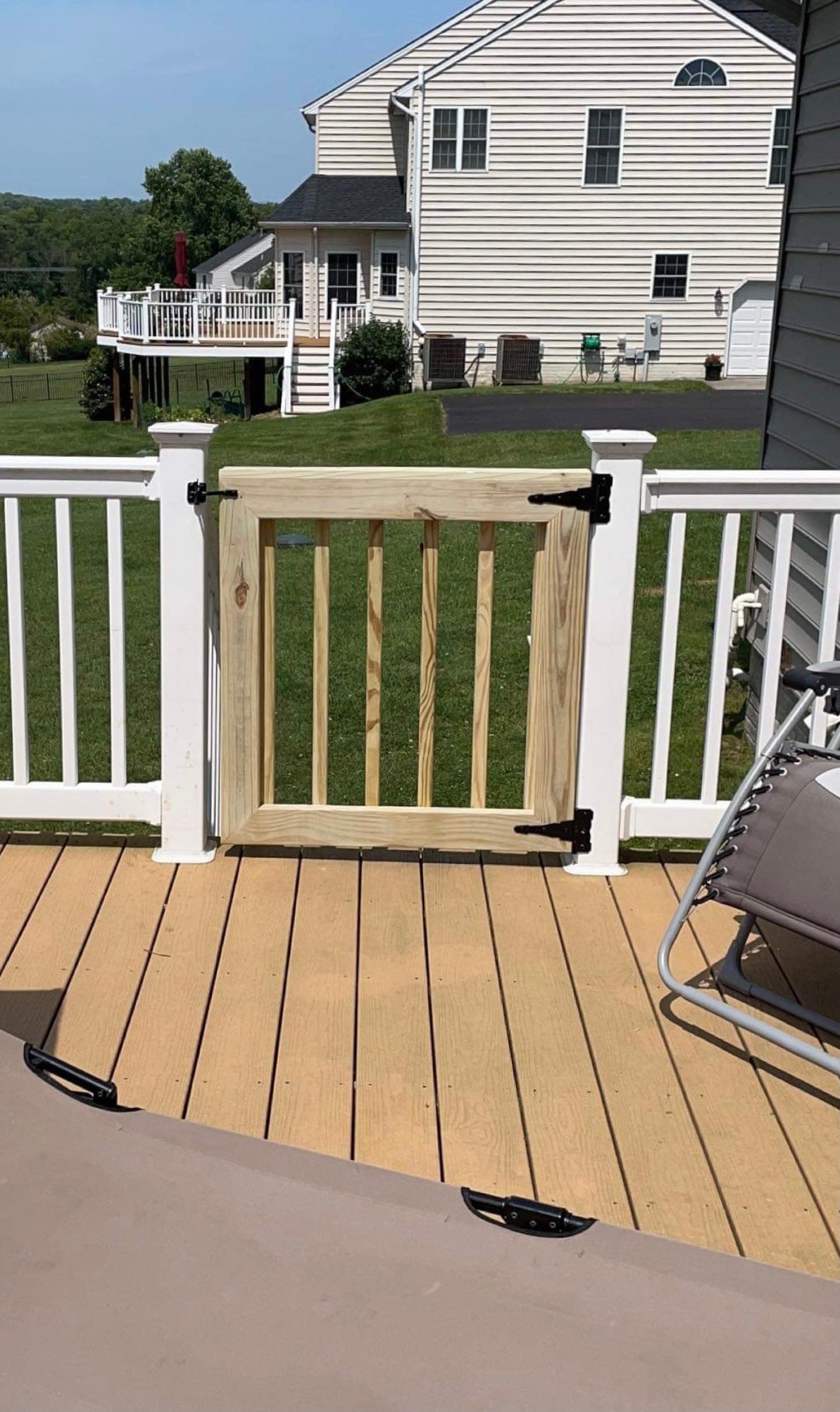 DIY-stlye wooden baluster gate built for outdoor patio entrances