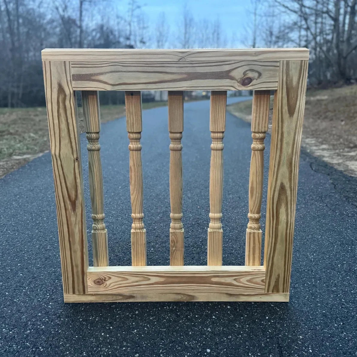 Rear view of a decorative wooden baluster gate, highlighting the detailed craftsmanship and sturdy construction, suitable for enhancing patio and deck aesthetics.