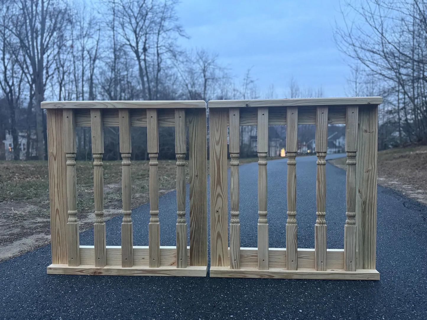Front view of a double decorative wooden baluster gate, showcasing its elegant design and sturdy construction, suitable for wide patio or deck entrances.