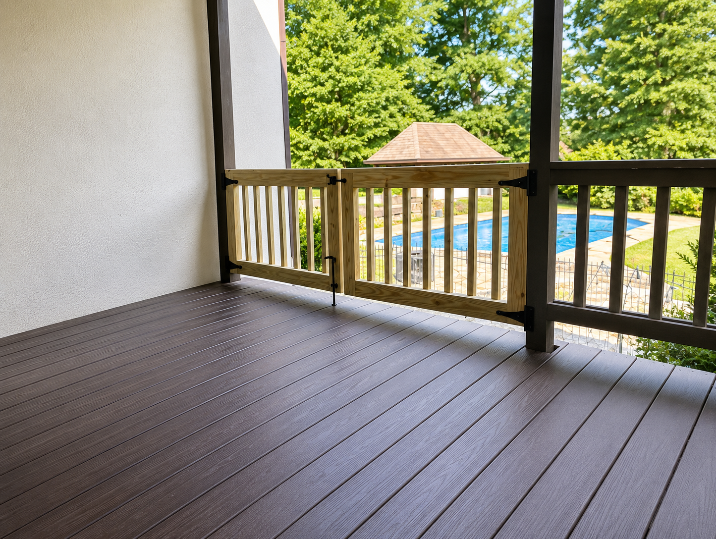 Custom wooden double deck gate side view overlooking pool area | Oak Street Gates