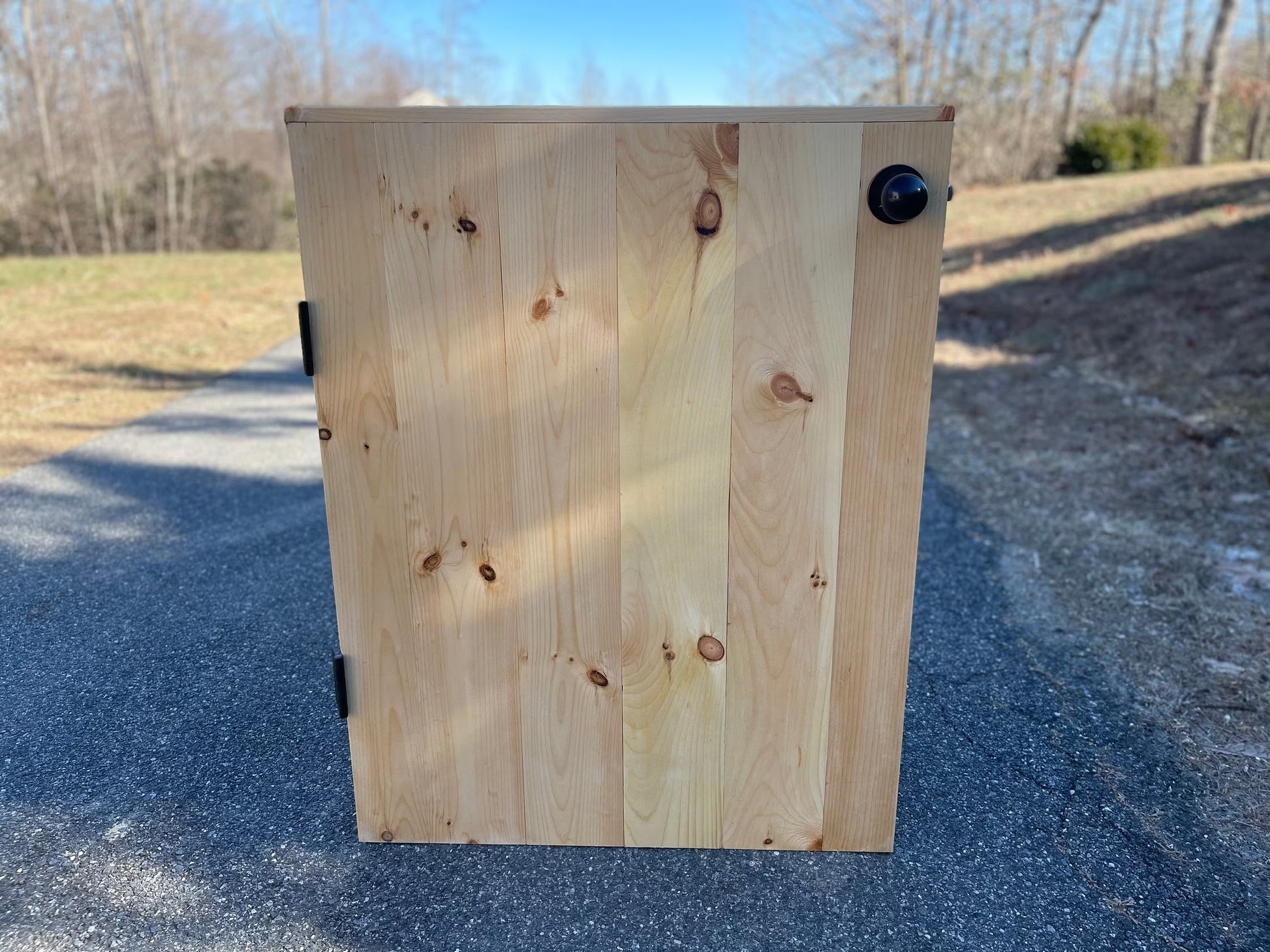 Rear view of custom K-Frame wooden indoor gate showing solid panel construction and hardware placement